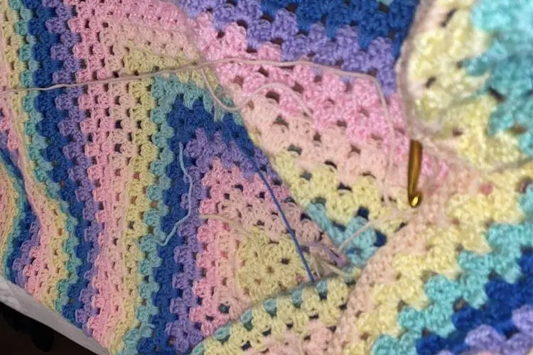 colorful crochet granny square blanket in progress